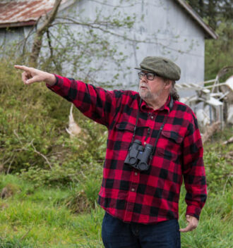 Paul Levesque surveying area of Tillamook wetland restoration.